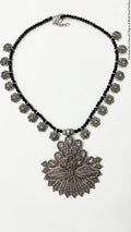 Peacock silver brooch and black beaded necklace